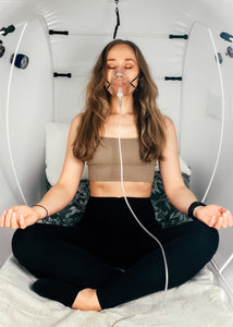 Woman in home hyperbaric oxygen chamber